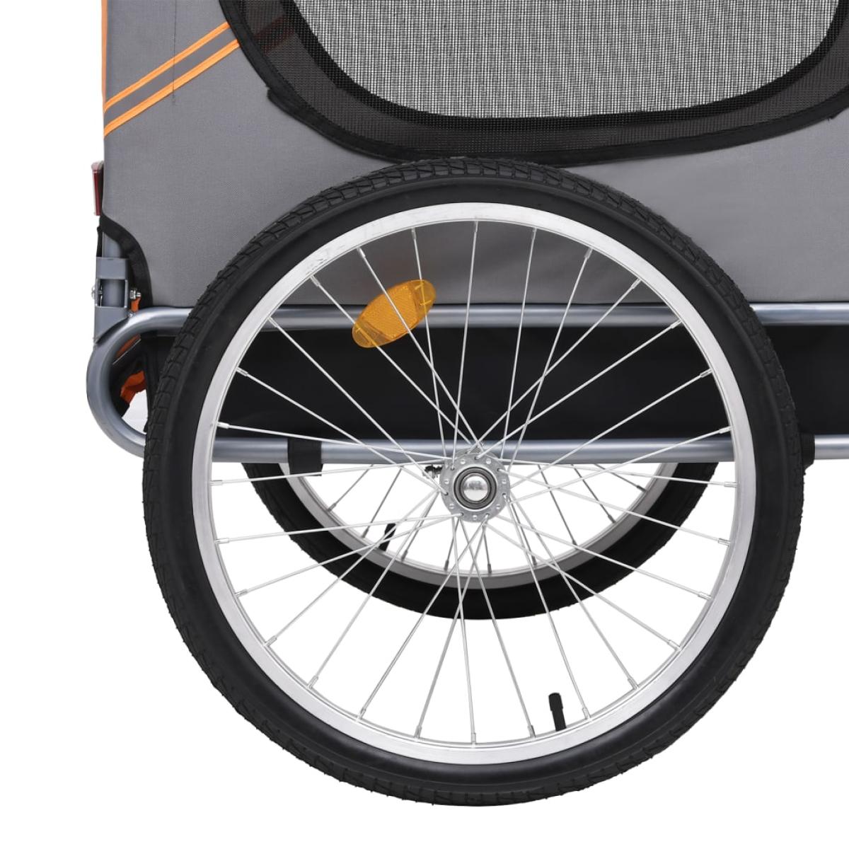 Remolque de bicicleta para perros naranja y gris