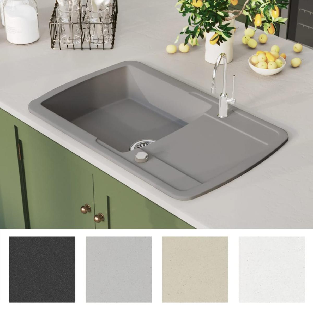 Fregadero de cocina con un seno de granito gris 