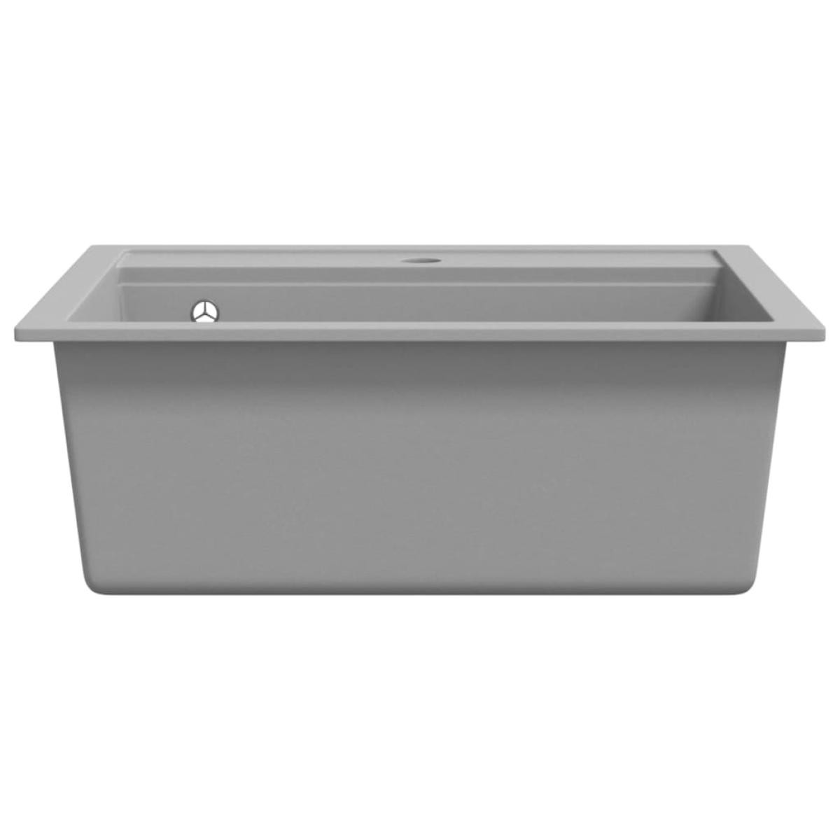 Fregadero de cocina de granito con un seno gris