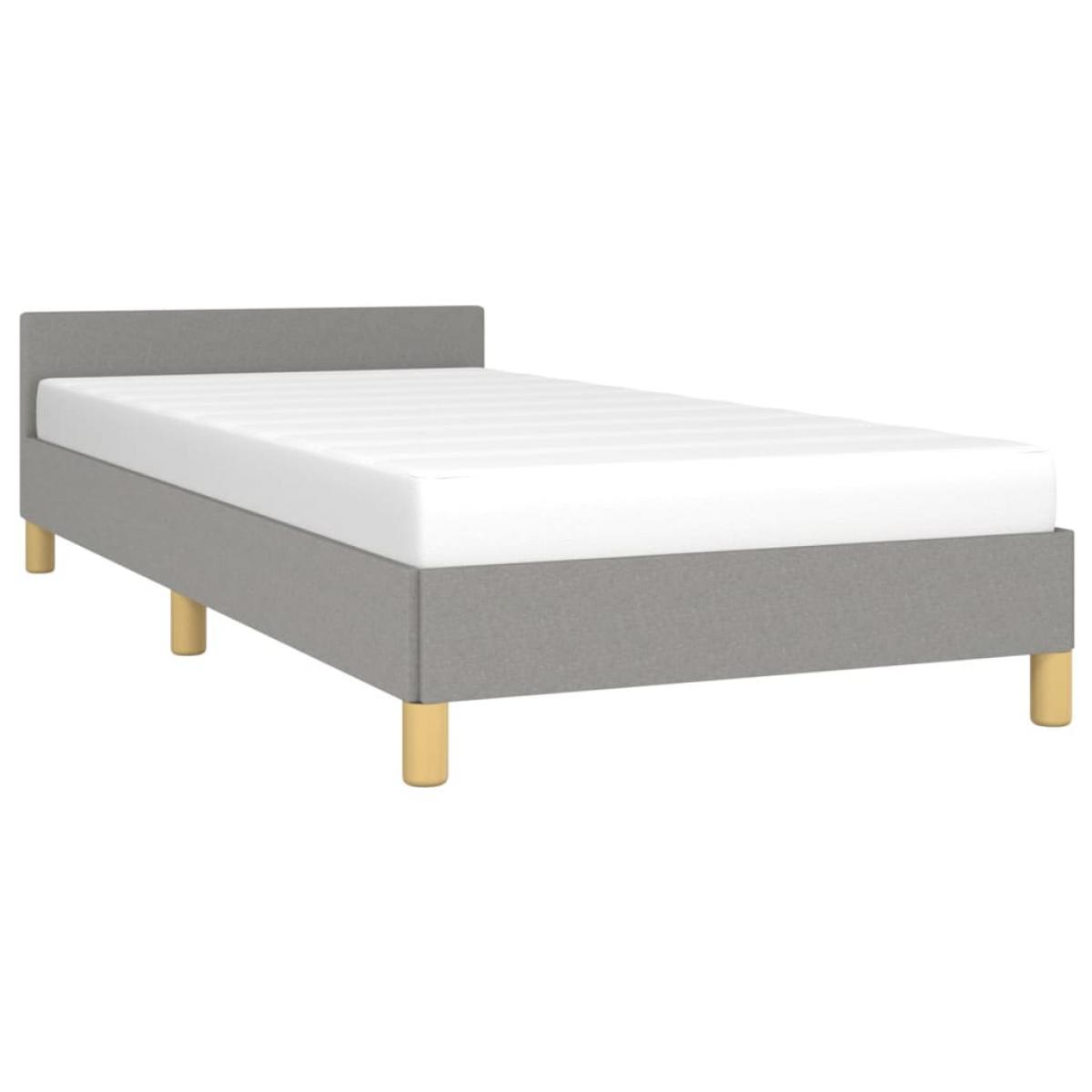 Estructura de cama con cabecero de tela gris claro 90x200 cm