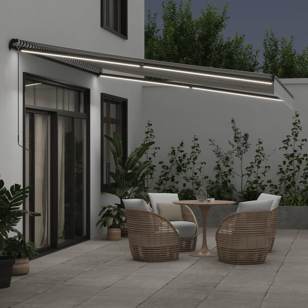 Toldo retráctil manual con luz LED amarillo y blanco 500x300 cm
